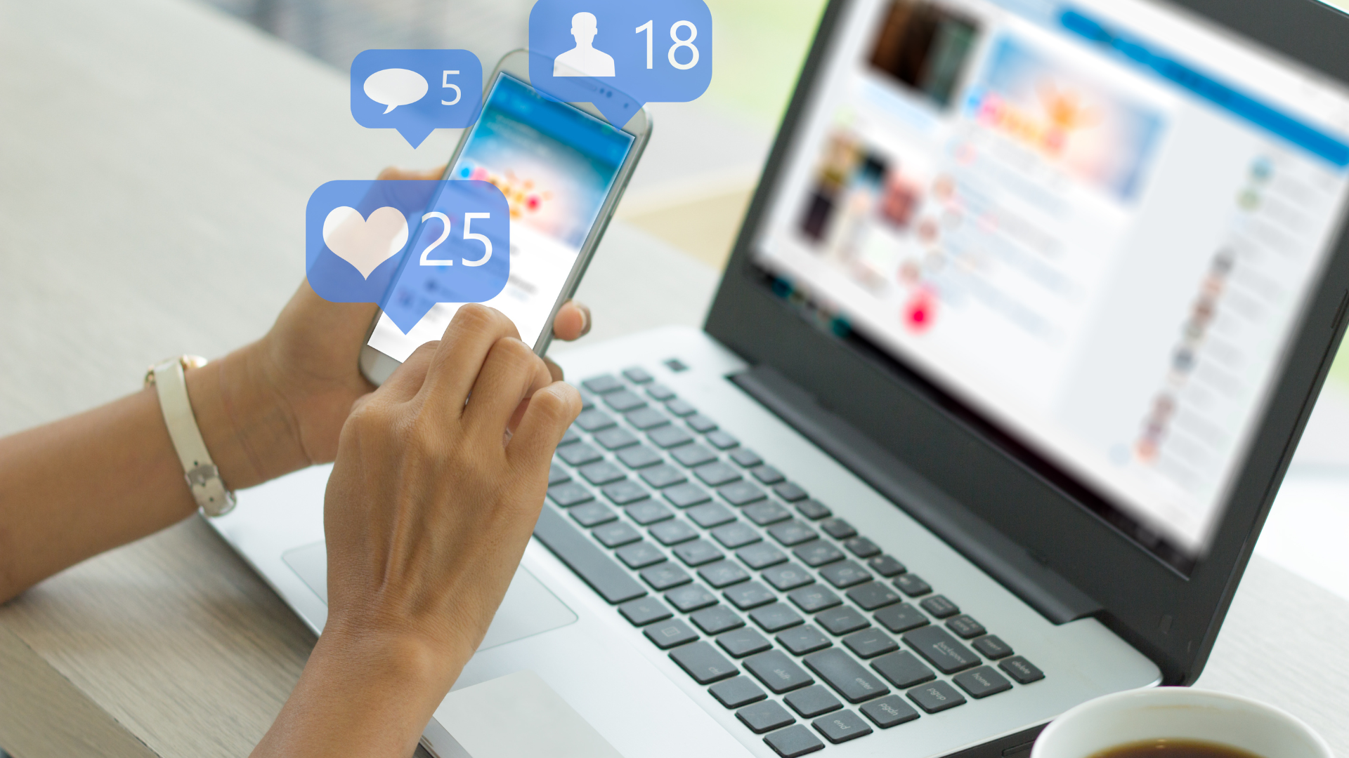 A person uses a smartphone in front of an open laptop, with social media notification icons for likes, comments, and friend requests displayed above the phone, illustrating an effective social media strategy in action. Opdee Digital Marketing